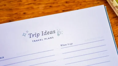 Photo of a page in a book entitled 'Trip Ideas, Travel Plans', 'When to go'. Lined page below