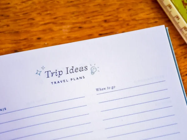 Photo of a page in a book entitled 'Trip Ideas, Travel Plans', 'When to go'. Lined page below