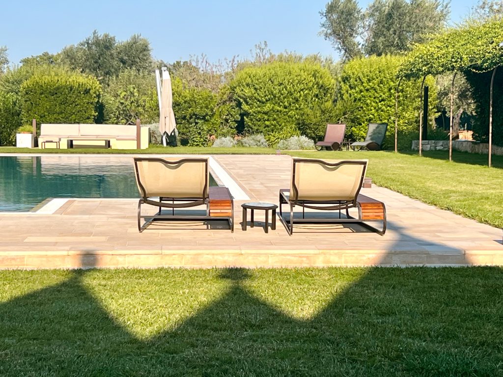 Sunloungers by the pool, villa holiday in Puglia, Italy, travelling with adult children