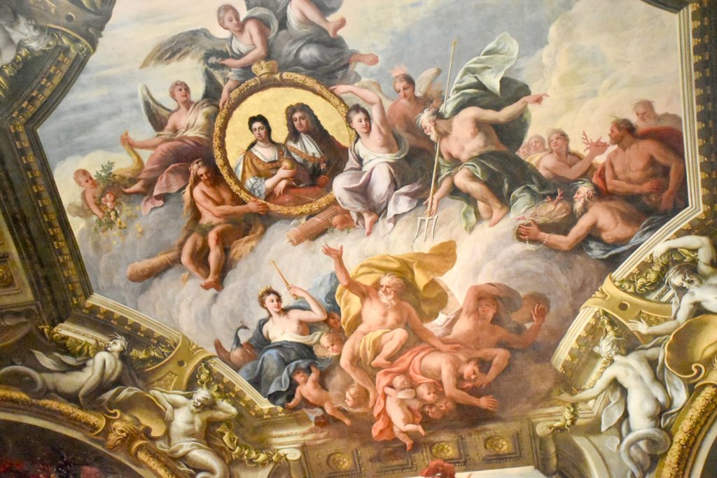 Painted ceiling of King and Queen surrounded by Gods and angels.