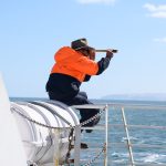 Man with spyglass solo travelling with nut allergy ferry to Kangaroo island Australia
