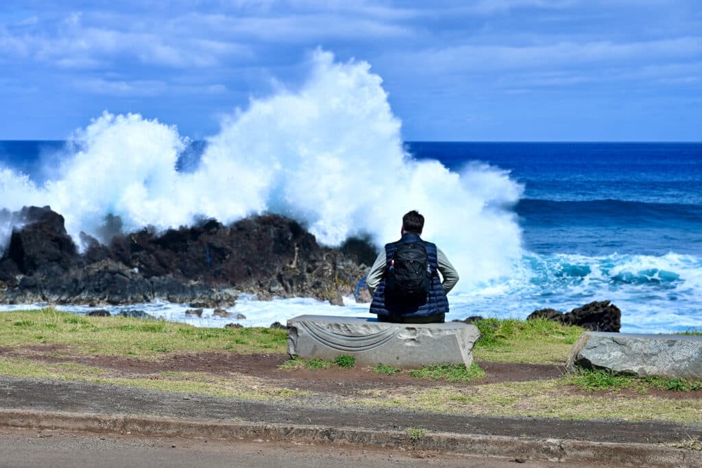 Man enjoying coastal holiday style on Rapa Nui, Easter Island,
