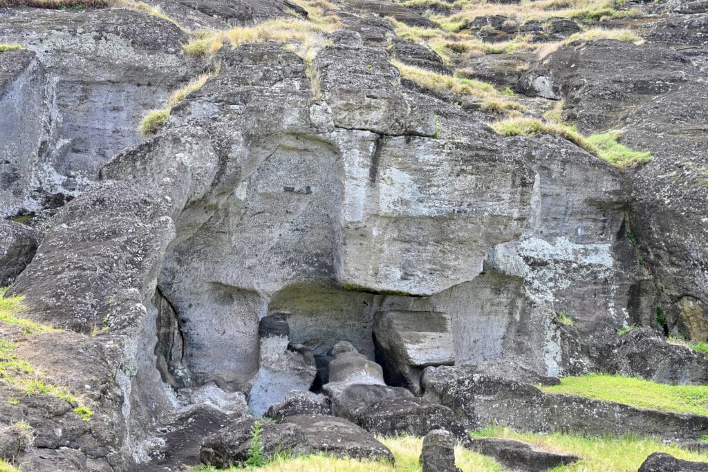 Large stone wall with evidence of statue carving at the base.