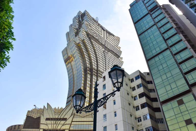 Tall modern glass building shaped like a lotus flower