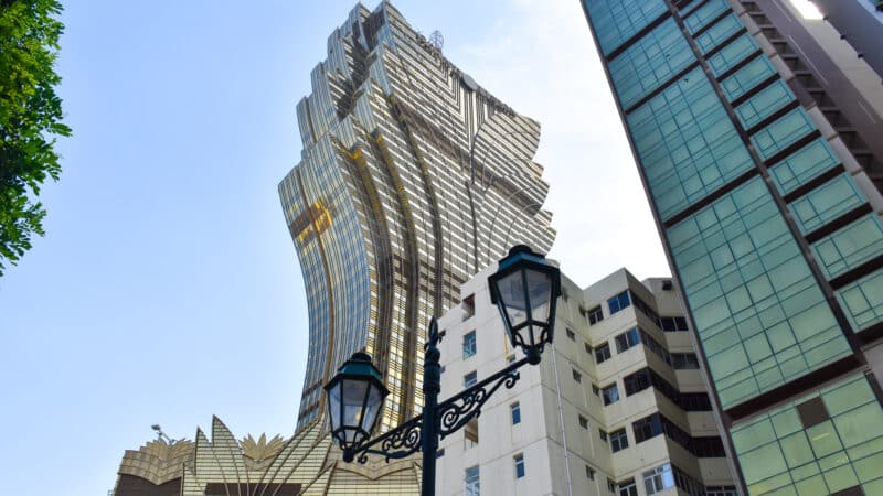 Tall modern glass building shaped like a lotus flower