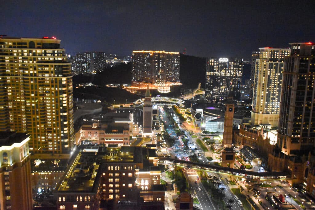 Looking down on night scene of modern buildings and towers