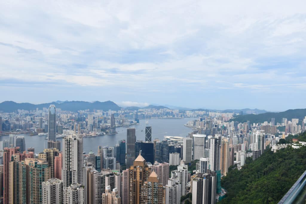 View over skyscrapers from a hill. Water running through the middle of them