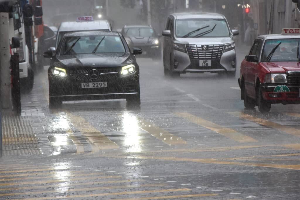 Cars on road covered in rain