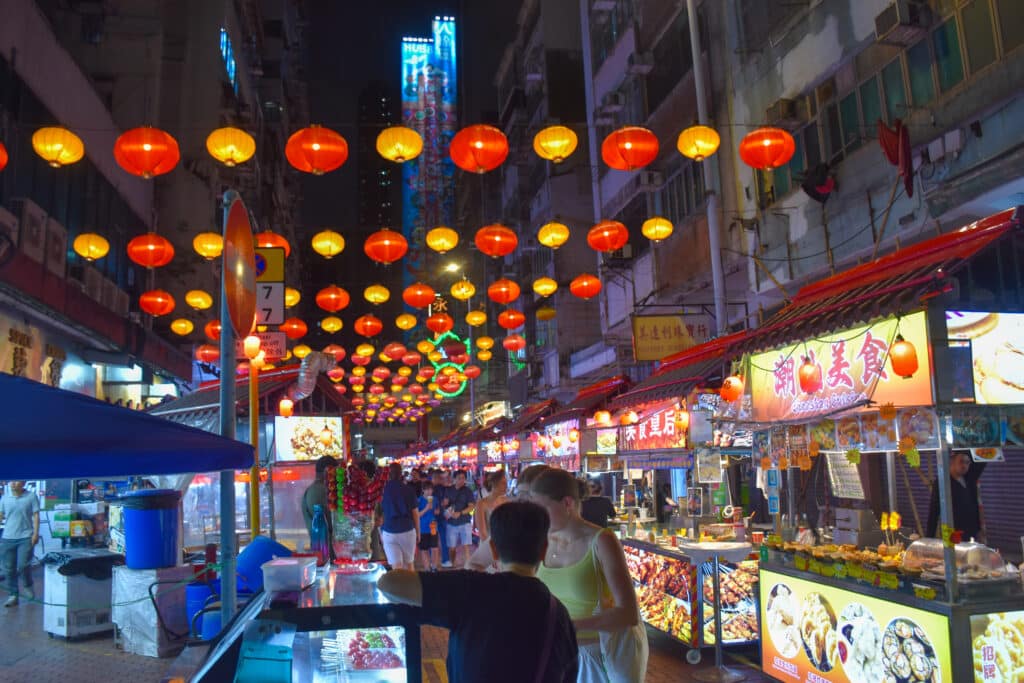 Red and white lanterns across a street night market