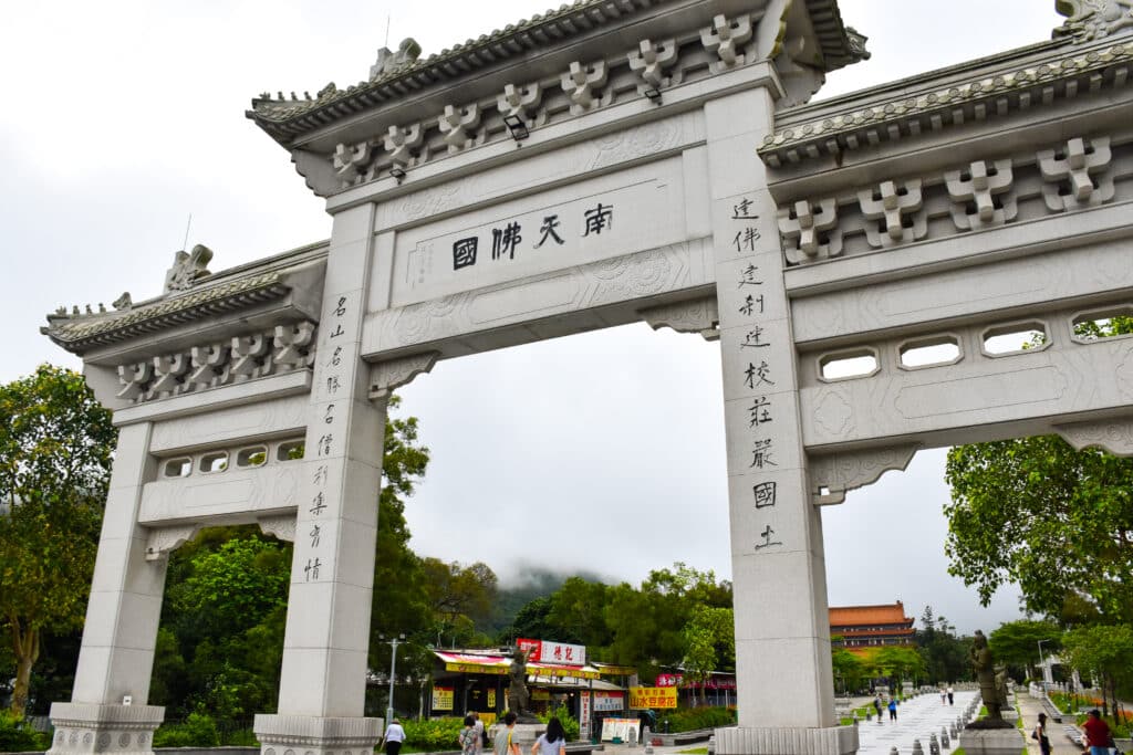 A large Chinese style white gate fills the frame