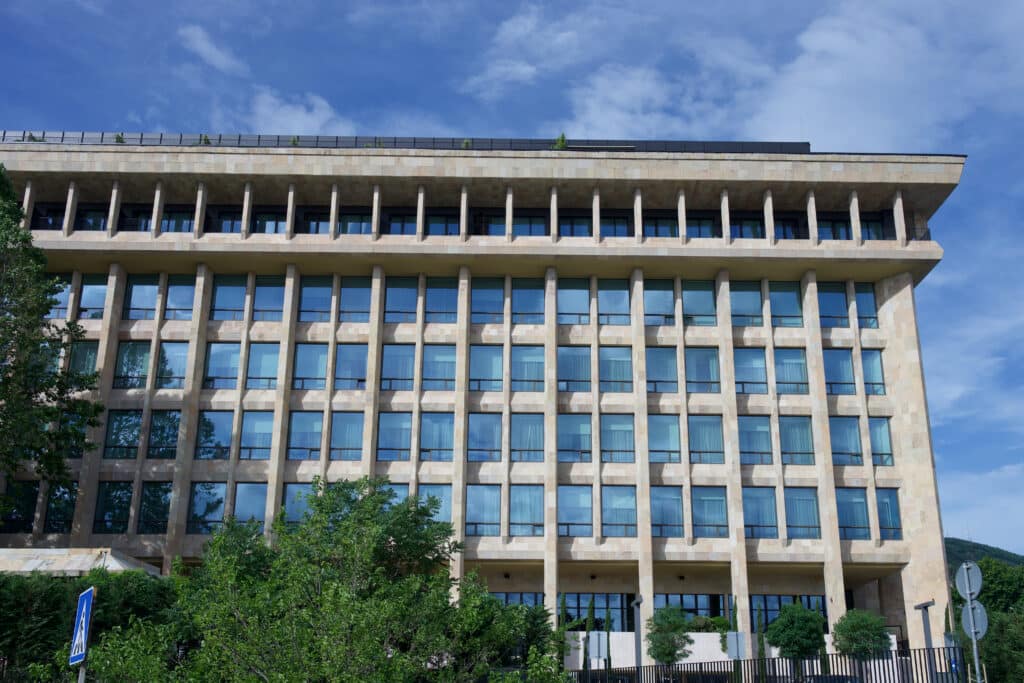 Large Soviet era building fills the frame. Lots of concrete and windows