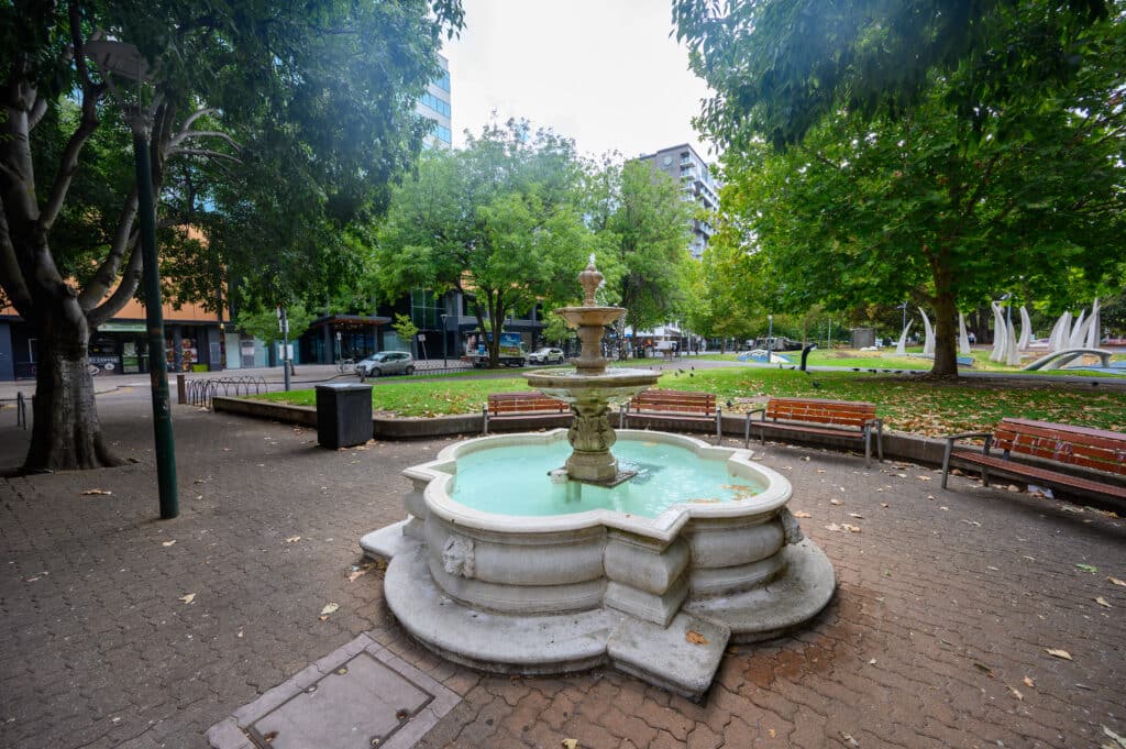 Solo travel in Adelaide peaceful city fountain with benches