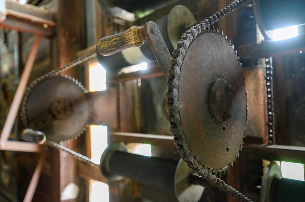 Adelaide Oval Tour close-up of historic rusty gears and chain mechanism
