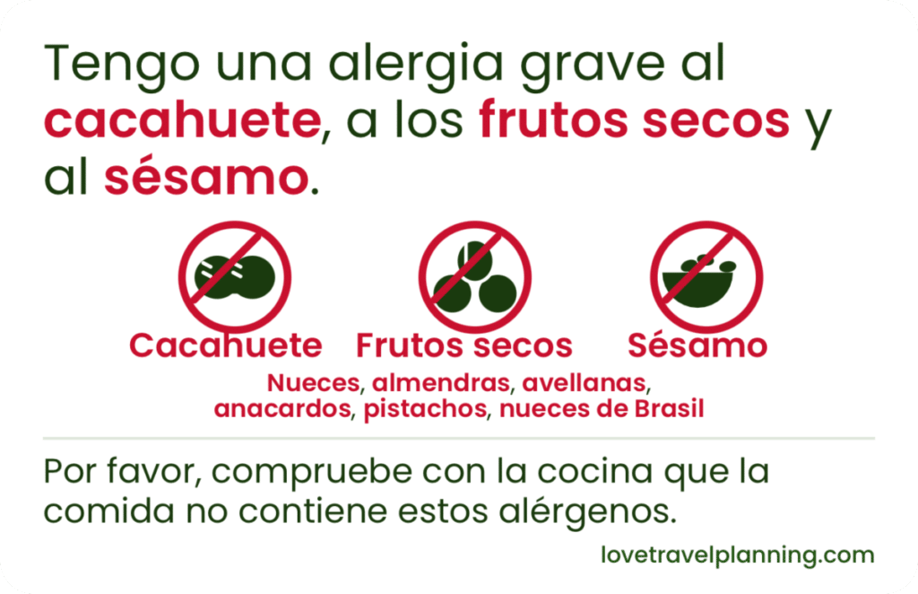 European Spanish nut allergy card stating a severe allergy to peanuts (cacahuete), tree nuts (frutos secos) and sesame (sésamo), with three crossed-out icons and a kitchen check request.